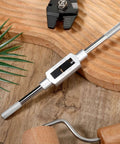 Adjustable Tap Wrench Handle For Machinists 1 Sixteenth Inch To 1 Half Inch Durable Alloy Steel on wooden background