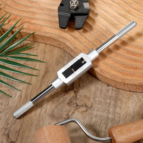 Adjustable Tap Wrench Handle For Machinists 1 Sixteenth Inch To 1 Half Inch Durable Alloy Steel on wooden background