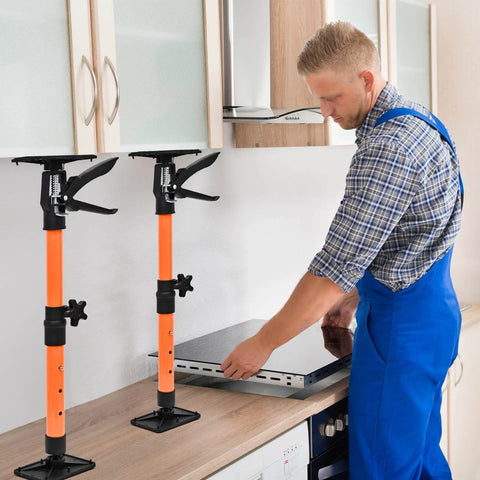 ✝️ Adjustable Support Pole - Cabinet Jack, Drywall Lift, 16.2-31.9Inch, two poles holding a cabinet, installer using kitchen countertop.
