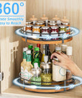 Adjustable 2 tier wooden lazy susan turntable organizer with 12 inch rotating design, spice rack filled with spices and sauces.