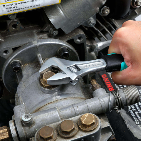 Wrench from 104 Piece Home Repair Tool Set With Easy Carrying Pouch For DIY Projects And Everyday Fixes Includes Hammer Pliers Magnetic Screwdrivers And Bits Wrenches Utility Knife Level And More In A Turquoise Portable Kit being used on engine.