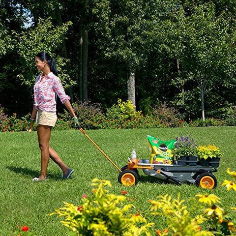Person maneuvering 8 in 1 Heavy Duty Aerocart Garden Cart Wheelbarrow Dolly with Turbo Lift Design and Flat Free Tires on grass