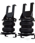 Premium air spring kit delivers up to 7500 lbs leveling, adjustable 5 to 100 psi, shown as two black air springs.