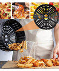 Person using Compatible For Airfryer Basket Replacement Grill Pan Oven Baking Tool Air Fryer Parts Plate Tray Food Divider Kitchen Accessories(15.5X15.5CM) to serve fries and chicken.