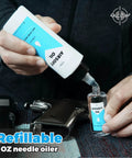 Man filling needle oiler with Airsoft Oil 4 oz & 1 oz Needle Oiler 100% Silicone Air Gun Oil, Multi-Purpose Airsoft Chamber Lube, All Purpose Silicone Lubricant for All Airgun next to airsoft gun.