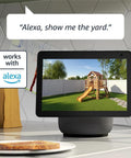 Smart display on kitchen counter showing live feed from wire-free two-camera outdoor security kit with Sync Module 2.