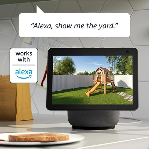 Smart display on kitchen counter showing live feed from wire-free two-camera outdoor security kit with Sync Module 2.
