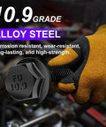 Mechanic holding 10.9 Grade black hex bolt from Metric Flange Bolt Set 400 Pcs, showcasing corrosion-resistant alloy steel material.