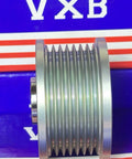 Side view of 31141-RV0-A01 Alternator Clutch Pulley Bearing for Honda Acura 3.5L V6, showcasing metal grooves and design.