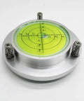 High precision 100mm bubble level gauge showing green circular display with calibration marks, aluminum housing, and mounting holes
