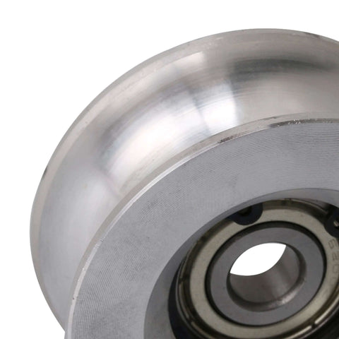 Close-up of a 60mm Diameter 25mm High Passive Round Guide Pulley Wheel made of Aluminum and Bearing Steel with 10mm Groove Radius.