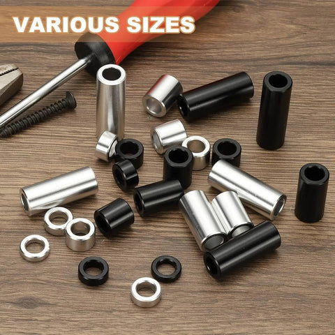 Assorted unthreaded round standoff bushings, featuring Six Piece Aluminum Spacers Set With Quarter Inch Inner Diameter And Half Inch Outer Diameter Three Quarter Inch Length Unthreaded Round Standoff Bushings For Quarter Inch Screws And Bolts Black Patikil, in various sizes, on a wooden surface with a screwdriver.