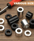 Assorted black and silver aluminum spacers on wooden table, ideal for electronics and mechanical projects, varying sizes visible.
