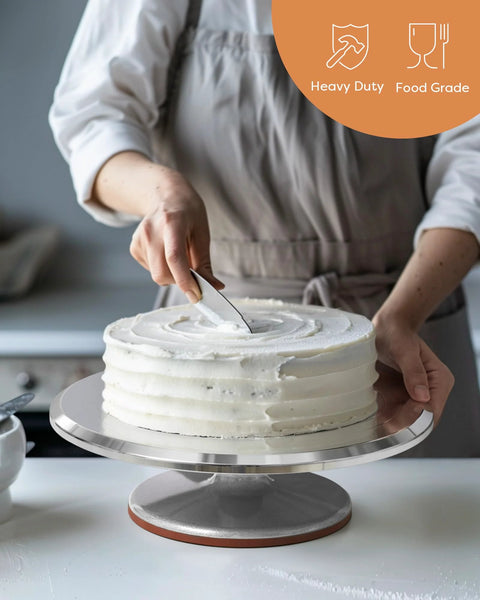 Chef decorating cake using Aluminum Alloy Revolving Cake Stand 12 Inch Rotating Turntable For Cake And Cupcake Decorating Supplies