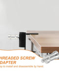 Six Pack 1/4 To 1/4 Camera Spigot Screw Converter Female To Male Adapters Aluminum Alloy shown attached to a table edge