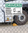 Chock Wheels Before Loading And Unloading Sign For Drivers, 10 By 14 Inch Aluminum, displayed on a truck.
