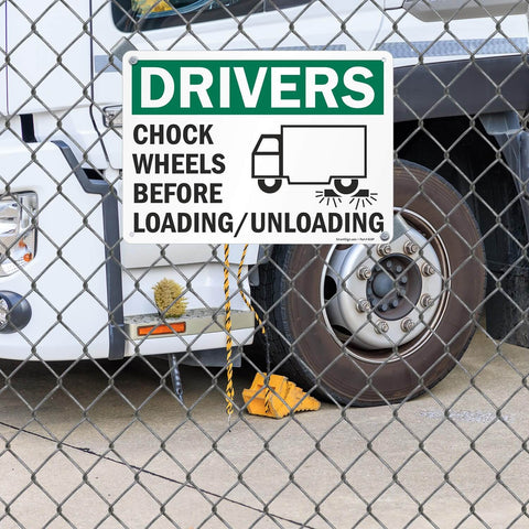 Chock Wheels Before Loading And Unloading Sign For Drivers, 10 By 14 Inch Aluminum, displayed on a truck.