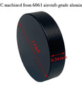Side view of black 1.3-inch disc, 0.34-inch thick, CNC machined from 6061 aircraft-grade aluminum for high precision use.