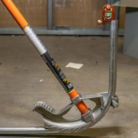Compact 2.5 inch no-dog conduit bending level with 1 vial and ACCU-BEND design on metal pipe, orange aluminum body