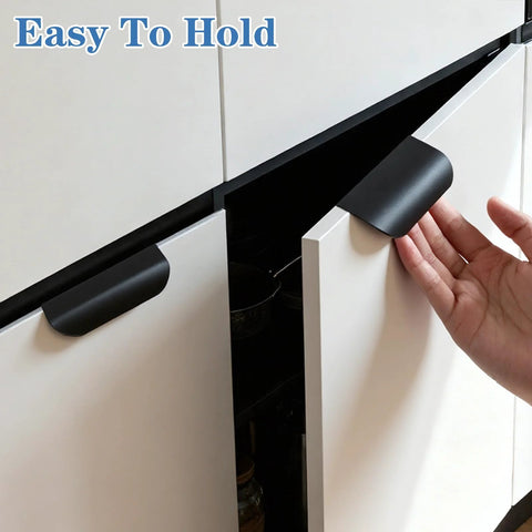Hand holding one of the Five Piece Edge Finger Pulls For Cabinets Aluminum Alloy Concealed Handles No Drilling Required Easy Install Modern Farmhouse Style.