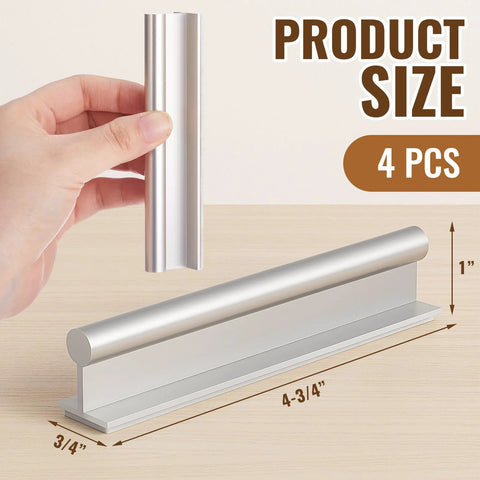Hand holding one of the Four Pcs SelfAdhesive Edge Finger Pull Door Handles For Cabinets Closets And Sliding Doors Screwless Peel And Stick