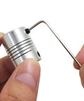 Close-up of 5 Pcs Flexible Couplings 5mm To 8mm Shaft For NEMA 17 Stepper Motors Compatible With Small CNC Machines and Allen wrench