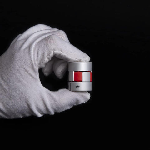 Gloved hand holding Flexible Shaft Coupling For 3D Printers And CNC Machines With Aluminum Alloy Body D25 L30 6-10mm Bore