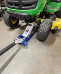 3000 Lb Aluminum Racing Car Auto Floor Jack Low Profile Rapid Pump Lift in use under riding mower, strong fit on shop floor.
