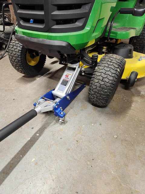 3000 Lb Aluminum Racing Car Auto Floor Jack Low Profile Rapid Pump Lift in use under riding mower, strong fit on shop floor.