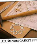 Aluminum All In One Leakproof Gasket Kit With 200 Pieces And Multi Size Crush Washers displayed on a workbench with tools and instructions.