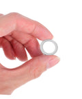 Close-up of a hand holding a single aluminum crush washer from the Aluminum All In One Leakproof Gasket Kit With 200 Pieces And Multi Size Crush Washers For Automotive And Industrial Maintenance And Emergency Repairs For Gearheads Pro Grade Lightweight Drain Plug Gaskets For Quick Fixes.