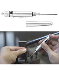 Aluminum Precision Vehicle Oiler Pen With Pinpoint Applicator And Pocket Clip Cover, shown with cap off, in use for engine lubrication.