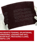 Gloved hands holding General Purpose Very Fine Aluminum Oxide Hand Pad For Scuffing And Cleaning 6x9