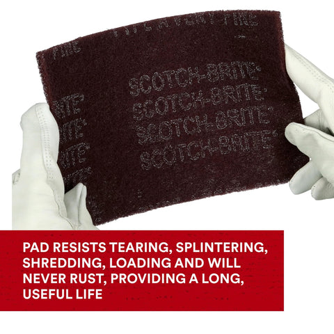 Gloved hands holding General Purpose Very Fine Aluminum Oxide Hand Pad For Scuffing And Cleaning 6x9
