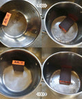 Four Pcs Aluminum Oxide Sanding Blocks Grit 60 80 120 220 for Wood Metal Drywall demonstrating cleaning a metal pot.