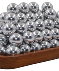 Pile of shiny hard .68 cal aluminum paintballs on wooden tray, 50 x 68 Caliber Self Defense Balls, for Byrna SD LE TCR use