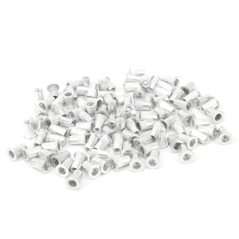 Premium Aluminum Pull Rivet Nuts Set For Metal Plates And Pipes M3 Through M10 With M4 100 Pieces in a scattered arrangement