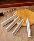 Four Pcs SelfAdhesive Edge Finger Pull Door Handles For Cabinets Closets And Sliding Doors on a wooden surface