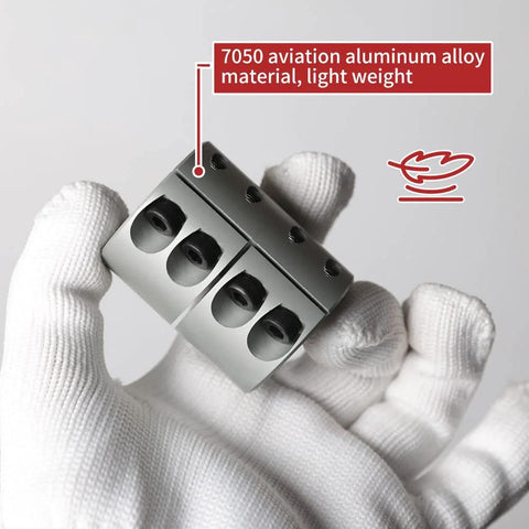 Rigid 14mm to 14mm aluminum shaft coupling with a clamp-on design shown in hand, showcasing 7050 aviation aluminum alloy material.