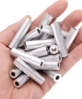 Hand holding Pro Grade Heavy Duty Aluminum Spacer Set for M5 Screws and Rods, 5mm bore, 10mm OD, 40mm length, 20 pieces, plain finish.