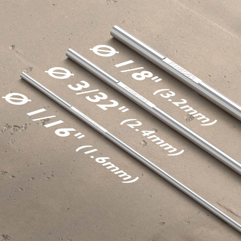 Different sizes of welding rods on concrete surface, highlighting ER4043 Aluminum TIG Welding Rod One Eighth Inch Diameter By Sixteen Inch Length Five Pound Pack For A Stable Arc With Low Spatter And Great Fluidity From High Silicon Content Welds Smooth With Argon Or Argon Helium Gas Pro Grade For Easy Aluminum Welds.