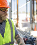 Construction worker wearing Proximity Safety Glasses With Amber Lens H2X Anti Fog And UVA BC Protection on a building site