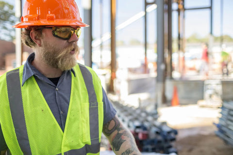 Construction worker wearing Proximity Safety Glasses With Amber Lens H2X Anti Fog And UVA BC Protection on a building site