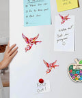 Set Of 3 Angel With Machine Gun Stickers Funny Gun Decals For Water Bottles Laptops Phones Cars Helmets Windows Bumpers Cupid Vibes And Hologram 3 Inch Vinyl Decals For Personalizing Any Smooth Surface, displayed on a refrigerator.