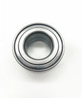 High-performance drop-in front wheel radial thrust angular-contact ball bearing with housing, OE A2469810006, viewed from top.