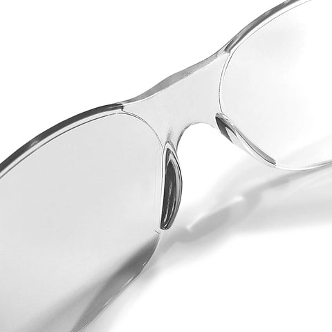 Close-up of ANSI Z87 safety glasses with impact-resistant lenses and UV protection in clear frame, part of 12-pack