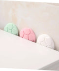 Side view of assorted green, pink, and white protective pads for washing machine and home use anti collision door handle bumpers