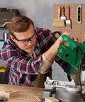 Person wearing Anti Fog Safety Goggles For Shooting With Clear Lens using a green power tool in workshop