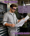 Man wearing Anti Fog Onion Goggles With Ultra Light Frame For Tear Free Cooking Purple in a workshop reading a blueprint.