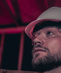 Worker wearing BearKat 3 Anti Fog Polycarbonate Safety Glasses With Non Slip Temples and hard hat on construction site
